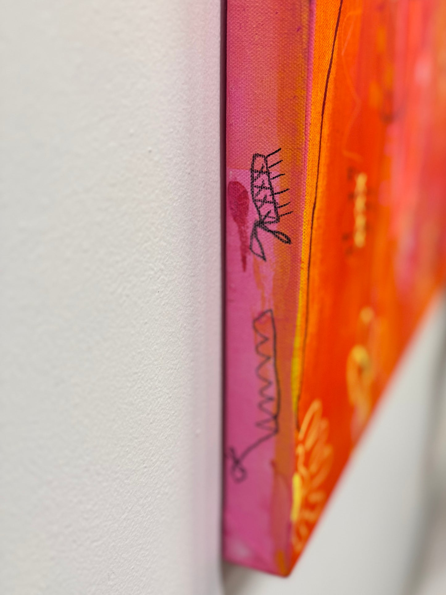 Side shot of a bright, colorful abstract painting titled "She's Still In There" by Marisa Gouda, capturing childhood wonder.