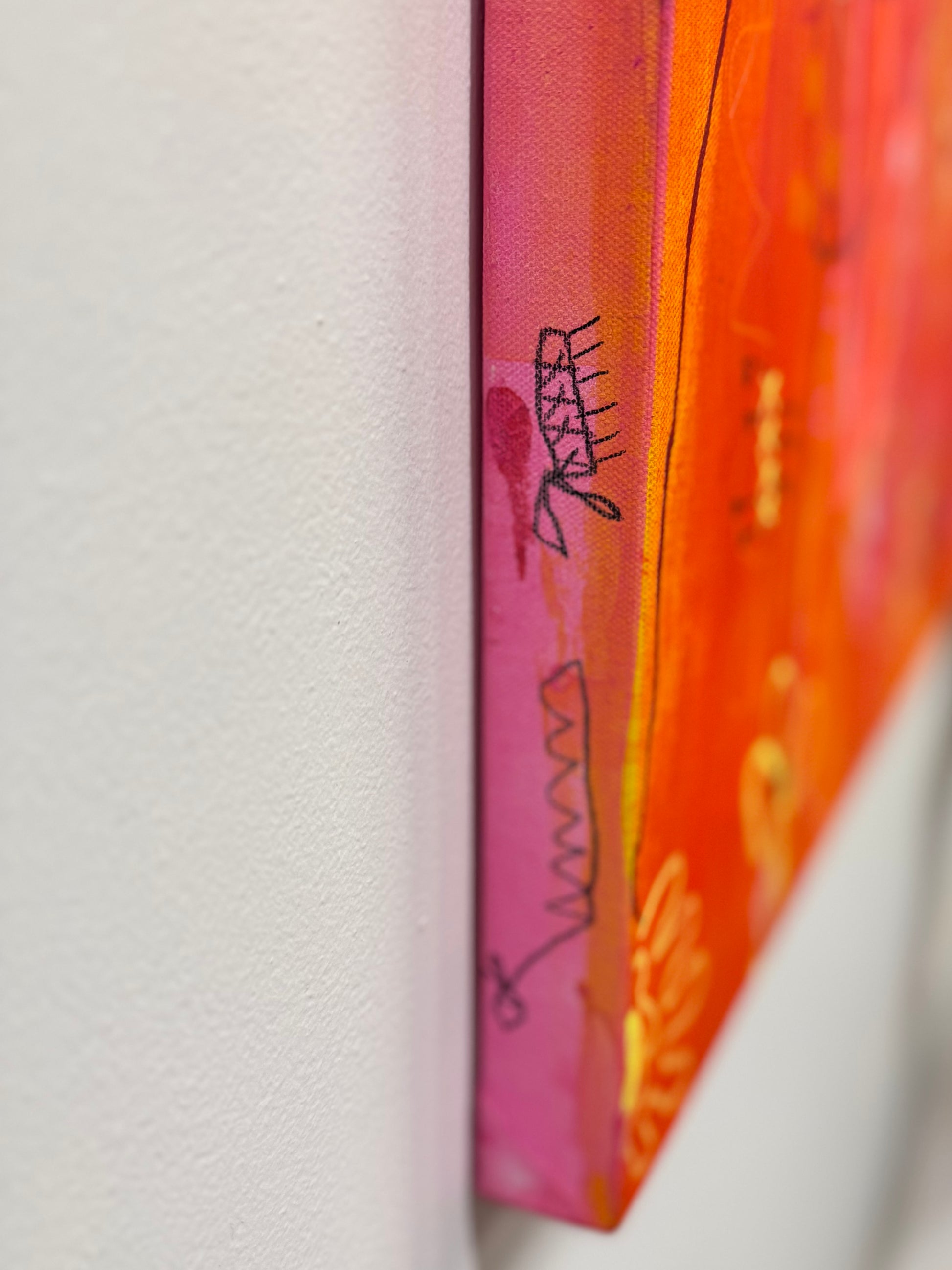 Side shot of a bright, colorful abstract painting titled "She's Still In There" by Marisa Gouda, capturing childhood wonder.